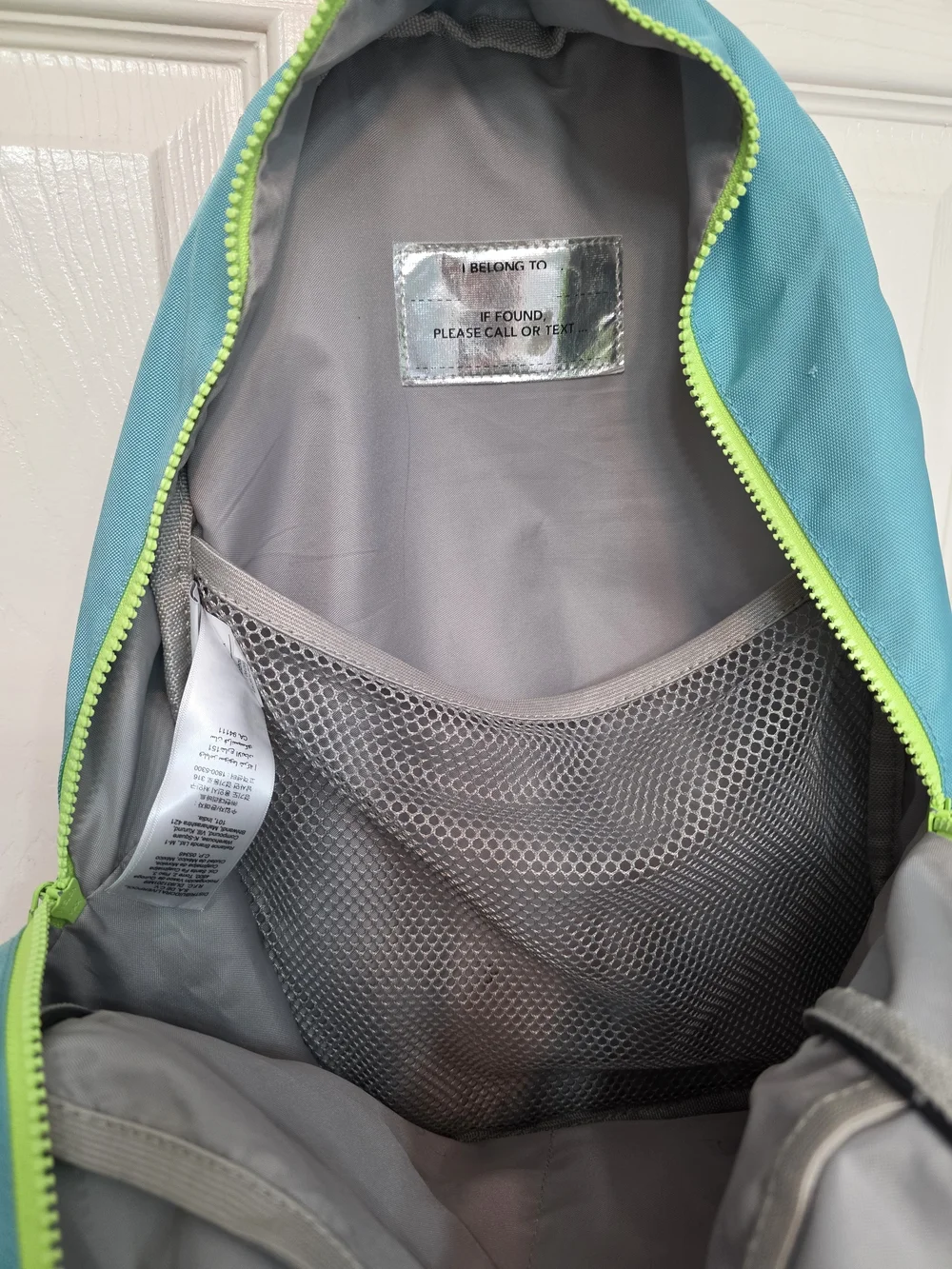 Pottery Barn Kids Astor Backpack featuring pink, aqua, and lime green colors.